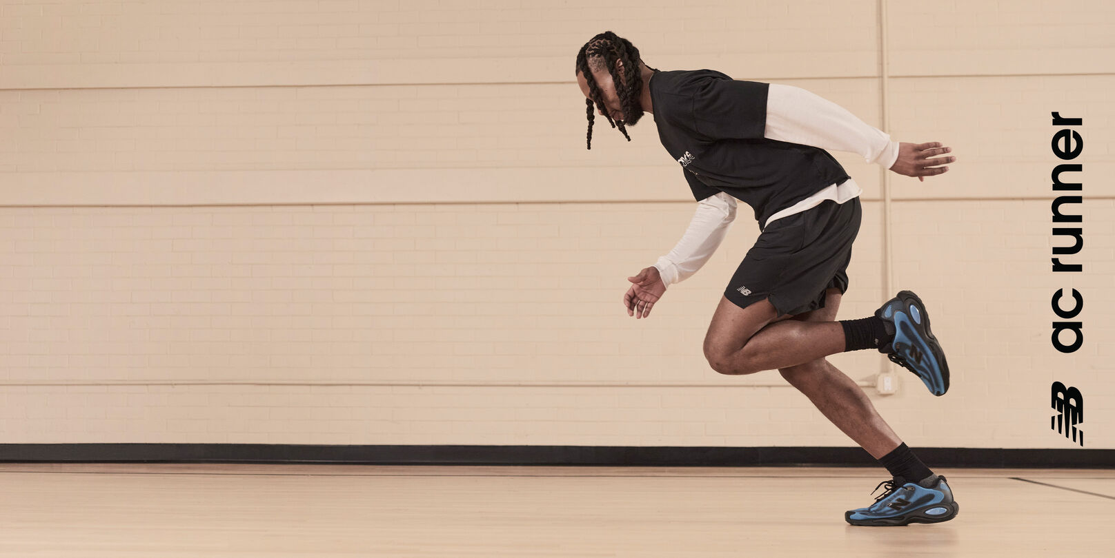    Darius Garland wearing the new black and blue AC Runners